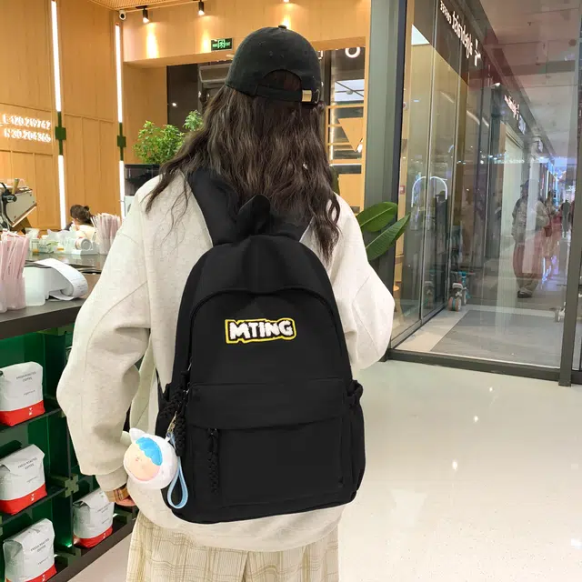 草丛喵喵喵 日系纯色休闲通勤旅行轻便高颜值大容量背包初中高中大学上课 尼龙 双肩包 男女同款情侣款 黑色/红色/灰色/黄色