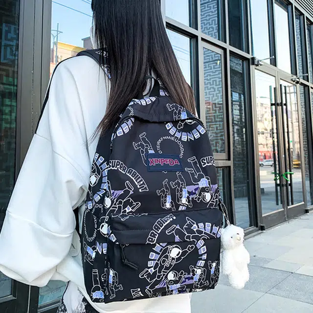草丛喵喵喵 潮流休闲大容量可爱涂鸦双肩包 情侣男女同款 背包高中大学生尼龙书包 常规 宇航员图案/字母图案/小熊图案