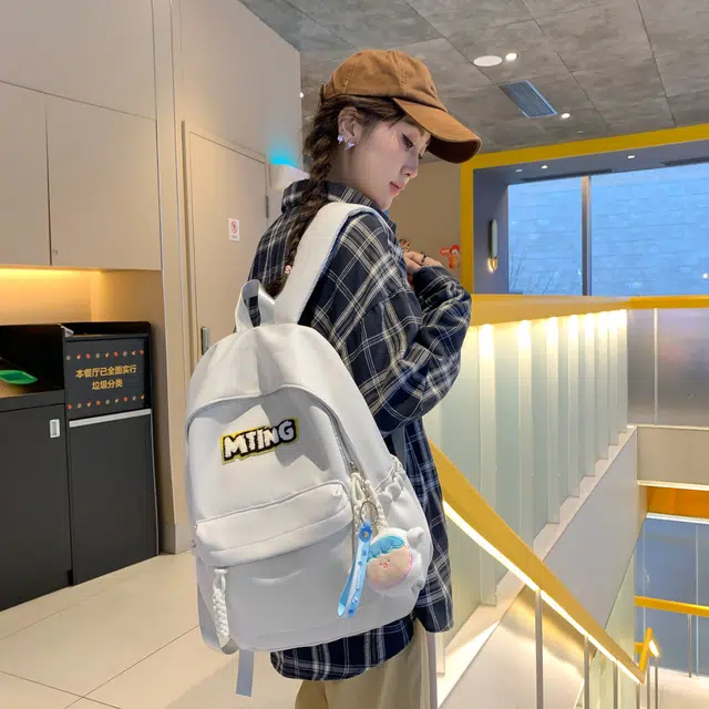 草丛喵喵喵 日系纯色休闲通勤旅行轻便高颜值大容量背包初中高中大学上课 尼龙 双肩包 男女同款情侣款 黑色/红色/灰色/黄色