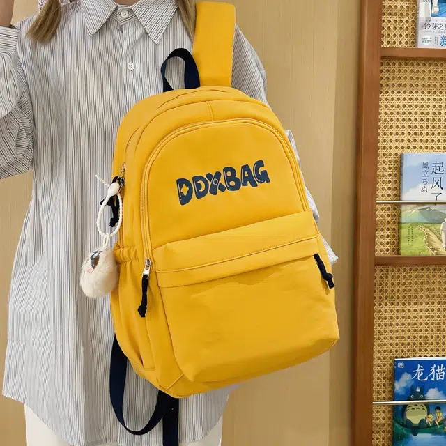 草丛喵喵喵 书包大学生夏季纯色高颜值简约轻便高中初中生百搭 涤纶 双肩包 男女同款情侣款 红色/黑色/黄色/深蓝色