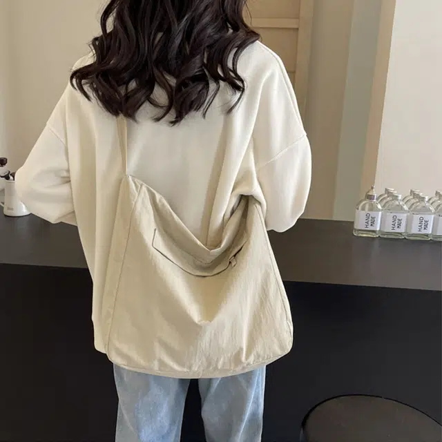 艾妮兔 简约百搭大容量通勤包 布 斜挎包单肩包 男女同款情侣款 米白色/黑色/蓝色/粉色/紫色