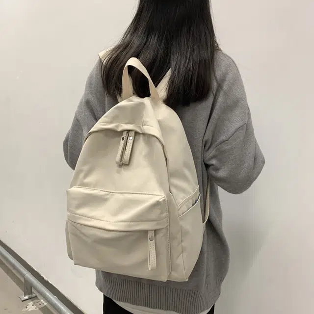 艾妮兔 日系简约百搭初高中大学生休闲通勤 帆布 书包帆布包双肩包 男女同款情侣款 米白色/卡其色/蓝色/黑色