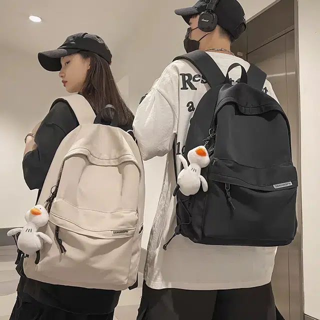 艾妮兔 简约大容量休闲 尼龙 双肩包 常规 男女同款情侣款 白色/黑色