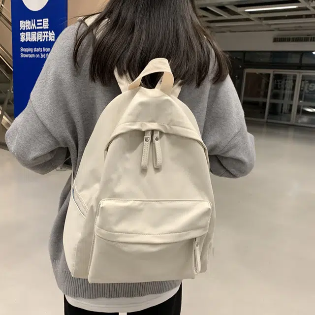 艾妮兔 日系简约百搭初高中大学生休闲通勤 帆布 书包帆布包双肩包 男女同款情侣款 米白色/卡其色/蓝色/黑色