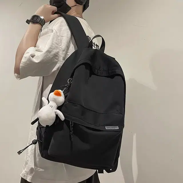 艾妮兔 简约大容量休闲 尼龙 双肩包 常规 男女同款情侣款 白色/黑色