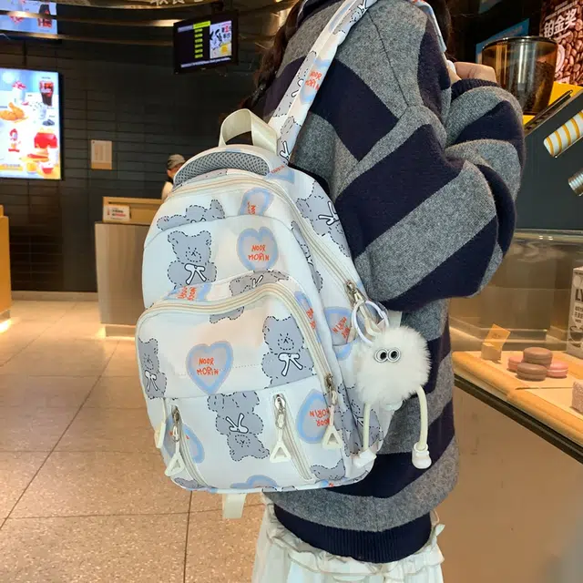 班亚奴 韩版潮流时尚卡通书包女生百搭初高中生轻便大容量 尼龙 背包双肩包旅行包 男女同款情侣款 黑色/蓝色/粉色/紫色