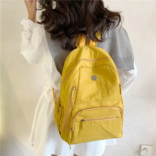 米囹 耐看百搭 尼龙布简约素雅酷舒适 亲肤日常 男女同款 轻盈 双肩包 常规 米白色/浅灰色/黑色/桔红色/黄色/卡其色/军绿色/浅蓝色