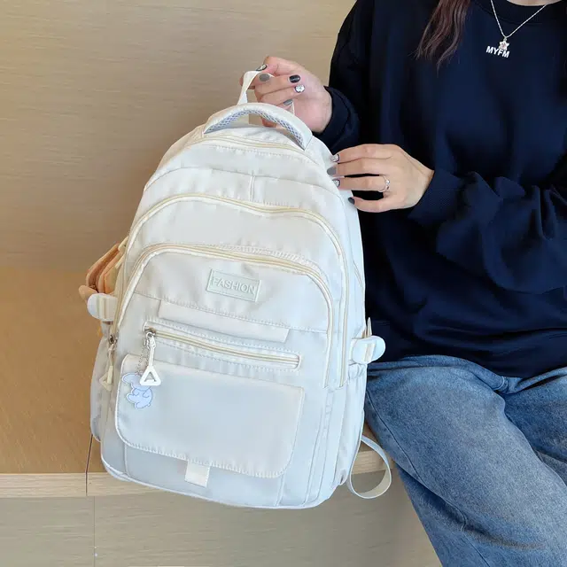米囹 上学单品百搭 背包大容量简约风 加宽肩带舒适男女同款 轻盈 双肩包 常规 乳白色/浅灰色/黑色/紫色/藏青色