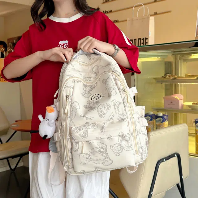 米囹 潮萌印花美感 学生向往质地亲肤耐磨 百搭户外男女同款 轻盈 双肩包 常规 乳白色/灰色/黑色/紫色/绿色