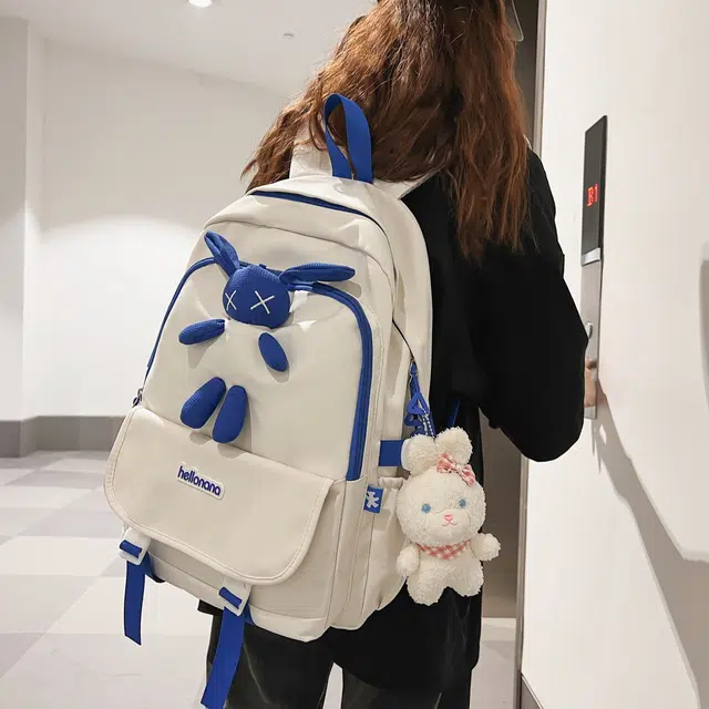 米囹 初中高中兔子装饰酷 通勤个性纯色耐看 男女同款 轻盈 双肩包 常规 白色/黑色/蓝色/粉色