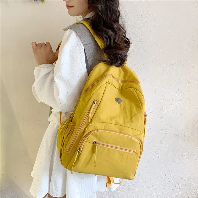 米囹 耐看百搭 尼龙布简约素雅酷舒适 亲肤日常 男女同款 轻盈 双肩包 常规 米白色/浅灰色/黑色/桔红色/黄色/卡其色/军绿色/浅蓝色