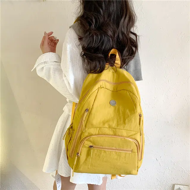 米囹 耐看百搭 尼龙布简约素雅酷舒适 亲肤日常 男女同款 轻盈 双肩包 常规 米白色/浅灰色/黑色/桔红色/黄色/卡其色/军绿色/浅蓝色