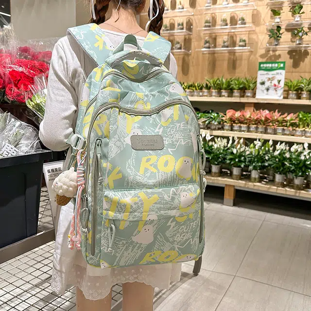 蔻蒂熊 涂鸦韩版印花书包初中高中中学生睿营大容量高颜值可爱潮流 涤纶 双肩包 常规 青少年 白色/黑色/紫色/绿色/粉色