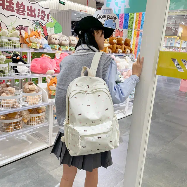 蔻蒂熊 高颜值日系可爱时尚简约小狗包学生大容量书包高级感小众百搭款轻便休闲背包 涤纶 双肩包 常规 青少年 白色