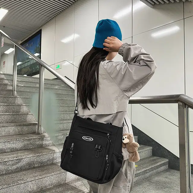 雅鹿 帆布包大容量男初中生装书包手提袋女通勤休闲拎书袋 尼龙 单肩包斜挎包 男女同款情侣款 黑色/红色/白色/蓝色