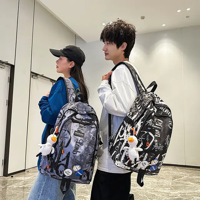 單倉 时尚个性街头涂鸦双肩包初高中学生百搭潮酷大容量旅行 尼龙 书包背包 常规 男女同款情侣款 蓝色/白色/黑色