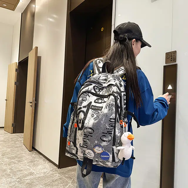 單倉 时尚个性街头涂鸦双肩包初高中学生百搭潮酷大容量旅行 尼龙 书包背包 常规 男女同款情侣款 蓝色/白色/黑色