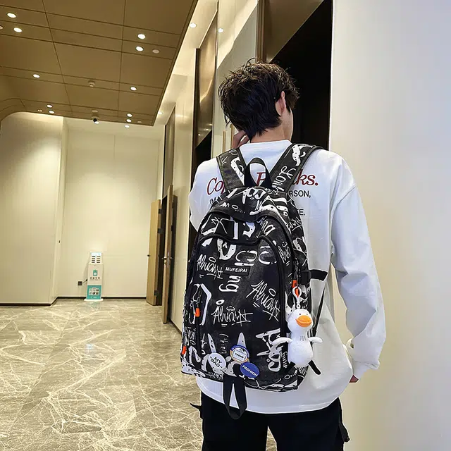 單倉 时尚个性街头涂鸦双肩包初高中学生百搭潮酷大容量旅行 尼龙 书包背包 常规 男女同款情侣款 蓝色/白色/黑色