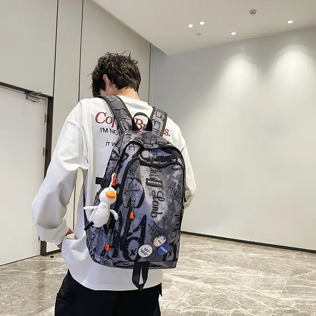 單倉 时尚个性街头涂鸦双肩包初高中学生百搭潮酷大容量旅行 尼龙 书包背包 常规 男女同款情侣款 蓝色/白色/黑色