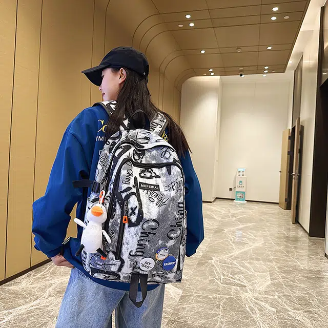 單倉 时尚个性街头涂鸦双肩包初高中学生百搭潮酷大容量旅行 尼龙 书包背包 常规 男女同款情侣款 蓝色/白色/黑色