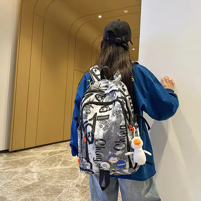 單倉 时尚个性街头涂鸦双肩包初高中学生百搭潮酷大容量旅行 尼龙 书包背包 常规 男女同款情侣款 蓝色/白色/黑色