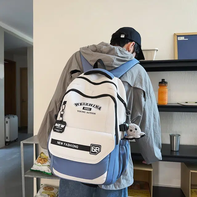 雅鹿 都市时尚青春活力设计小玩偶装饰书包旅行包 尼龙 双肩包 常规 男女同款情侣款 多色