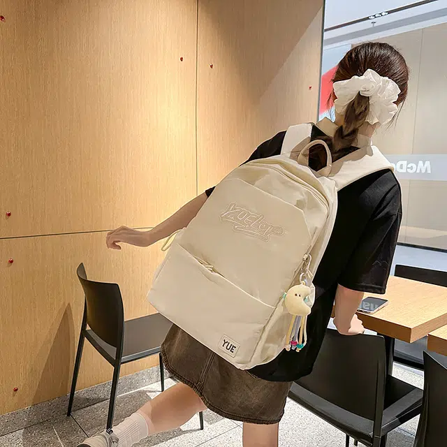 木木兔 超大容量书包女初中生减负高中生 小学生轻便背包 经典时尚小众设计 高级感 休闲拉链开合  尼龙布 双肩包 常规 米白色