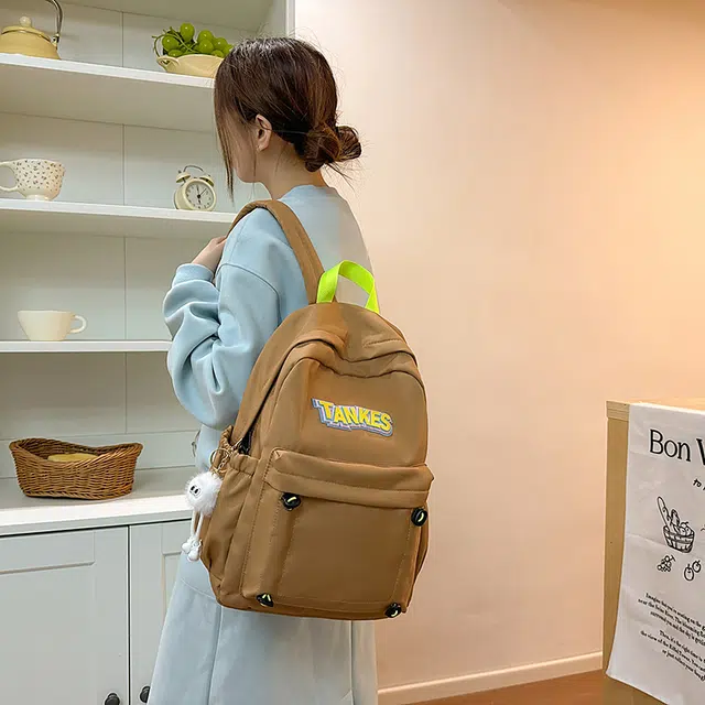 木木兔 轻便减压书包女高中生大容量减负初中小学生  经典时尚小众设计 高级感 休闲拉链开合  牛津纺 双肩包 常规 黑色