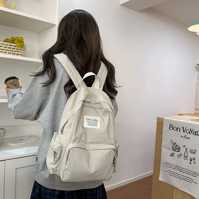 普乐威 韩版简约纯色小众字母书包上课通勤百搭大容量高颜值轻便旅游 尼龙 双肩包 常规 男女同款情侣款 多色