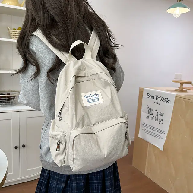 普乐威 韩版简约纯色小众字母书包上课通勤百搭大容量高颜值轻便旅游 尼龙 双肩包 常规 男女同款情侣款 多色