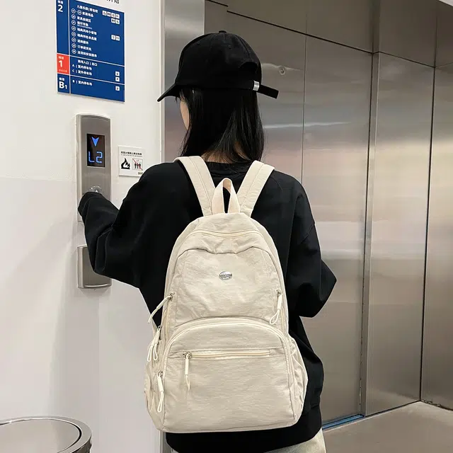 普乐威 高颜值轻便日系书包防泼水多兜电脑通勤百搭旅游 尼龙 背包双肩包 男女同款情侣款 米白色/黑色/卡其色