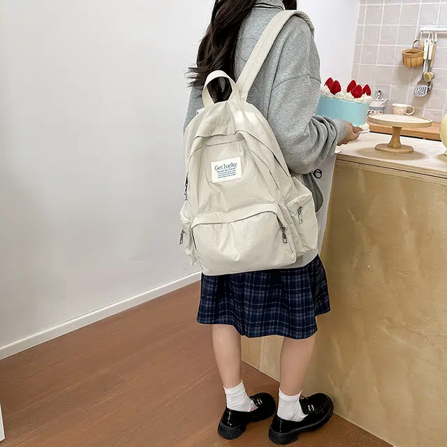 普乐威 韩版简约纯色小众字母书包上课通勤百搭大容量高颜值轻便旅游 尼龙 双肩包 常规 男女同款情侣款 多色