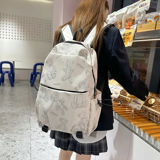 普乐威 高中生大容量轻便时尚潮流简约休闲百搭印花小熊背包大学生书包 尼龙 双肩包 男女同款情侣款 米白色/黑色