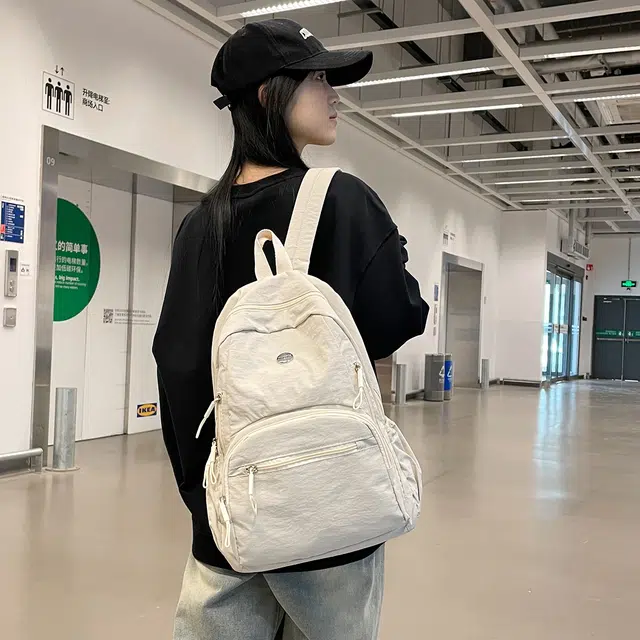 普乐威 高颜值轻便日系书包防泼水多兜电脑通勤百搭旅游 尼龙 背包双肩包 男女同款情侣款 米白色/黑色/卡其色