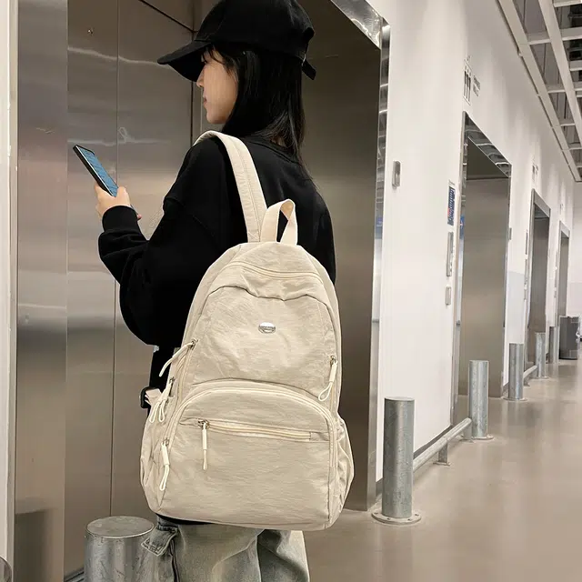 普乐威 高颜值轻便日系书包防泼水多兜电脑通勤百搭旅游 尼龙 背包双肩包 男女同款情侣款 米白色/黑色/卡其色