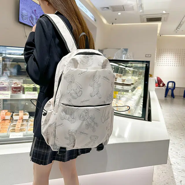 普乐威 高中生大容量轻便时尚潮流简约休闲百搭印花小熊背包大学生书包 尼龙 双肩包 男女同款情侣款 米白色/黑色