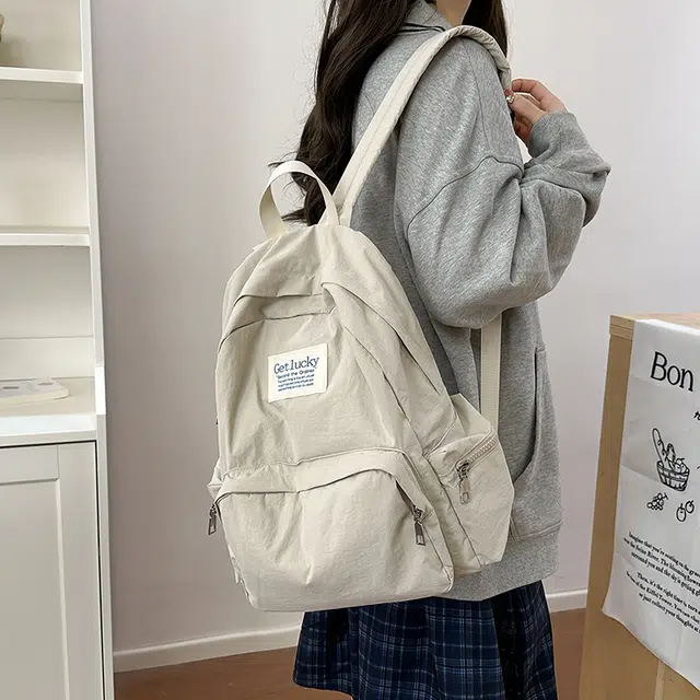 普乐威 韩版简约纯色小众字母书包上课通勤百搭大容量高颜值轻便旅游 尼龙 双肩包 常规 男女同款情侣款 多色