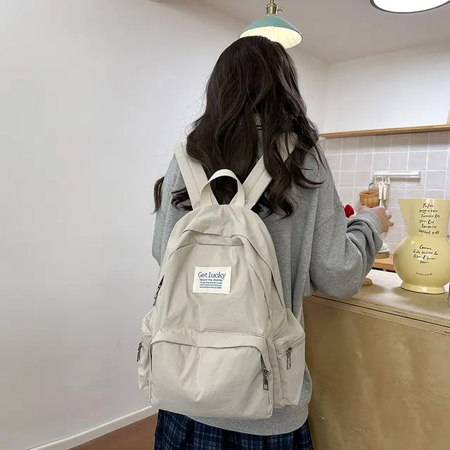 普乐威 韩版简约纯色小众字母书包上课通勤百搭大容量高颜值轻便旅游 尼龙 双肩包 常规 男女同款情侣款 多色