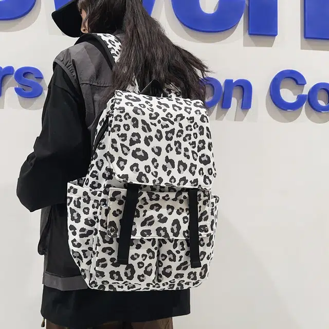 行途 韩版时尚休闲大容量校园日系翻盖豹纹 尼龙 双肩包 常规 男女同款情侣款 白色/蓝色/粉色