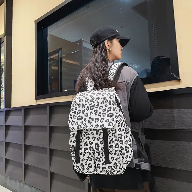 行途 韩版时尚休闲大容量校园日系翻盖豹纹 尼龙 双肩包 常规 男女同款情侣款 白色/蓝色/粉色