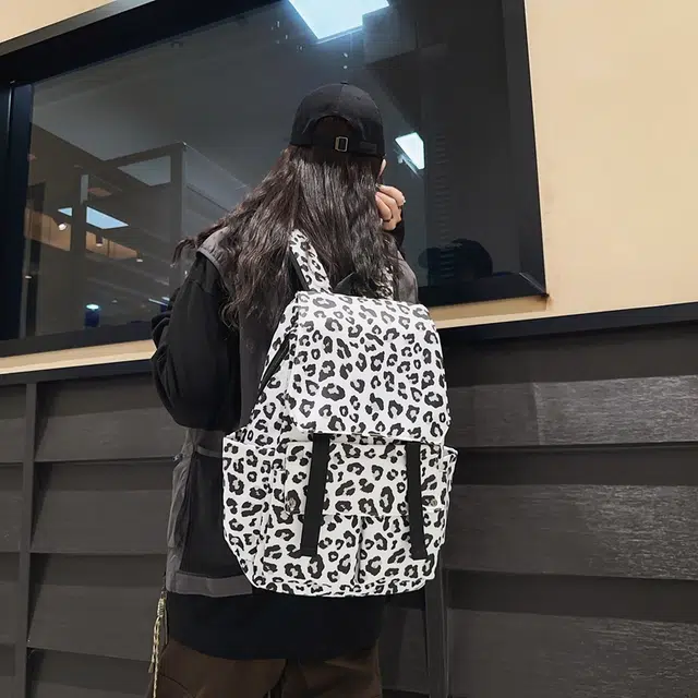 行途 韩版时尚休闲大容量校园日系翻盖豹纹 尼龙 双肩包 常规 男女同款情侣款 白色/蓝色/粉色