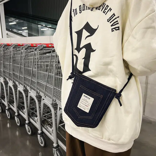 行途 春夏编织彩绳手机包潮酷运动男休闲 牛仔布 斜挎包 男女同款情侣款 黑色/蓝色