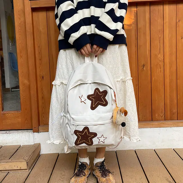 泰格奴 小清新休闲高颜值精美星星韩版背包初中生高中生大学生上课百搭书包 尼龙 双肩包 常规 女款 白色/黄色/蓝色/桔色/黑色