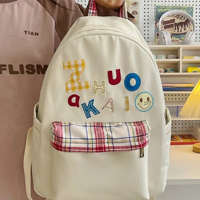 泰格奴 字母印花轻便简约国风大容量运动耐磨背包初中生高中生大学生上课百搭书包 尼龙 双肩包 女款 白色绿色黄色蓝色