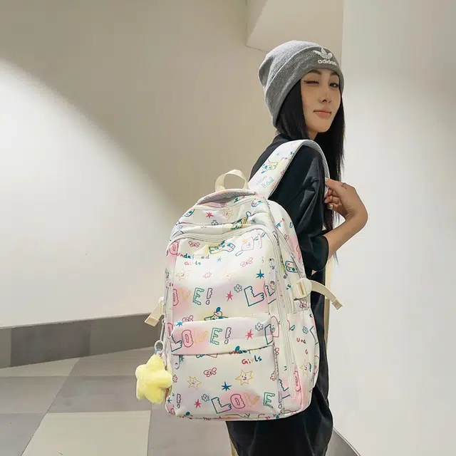 泰格奴 小清新休闲高颜值精美潮版韩版背包初中生高中生大学生上课百搭书包 尼龙 双肩包 男女同款情侣款 白色/黑色
