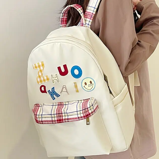 泰格奴 字母印花轻便简约国风大容量运动耐磨背包初中生高中生大学生上课百搭书包 尼龙 双肩包 女款 白色绿色黄色蓝色