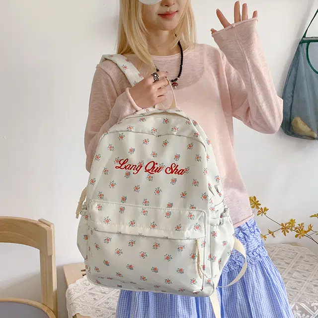 泰格奴 小清新休闲高颜值精美潮版韩版背包初中生高中生大学生上课百搭书包 尼龙布 双肩包 男女同款情侣款 黑色/红色