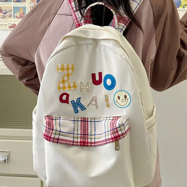 泰格奴 字母印花轻便简约国风大容量运动耐磨背包初中生高中生大学生上课百搭书包 尼龙 双肩包 女款 白色绿色黄色蓝色
