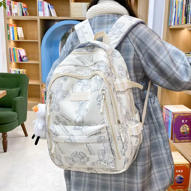 泰格奴 印花轻便简约大容量运动耐磨背包初中生高中生大学生上课百搭书包 尼龙 双肩包 男女同款情侣款 米白色/黑色/紫色/绿色