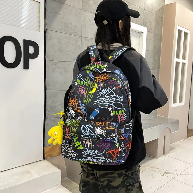 泰格奴 字母印花轻便简约国风大容量运动耐磨背包初中生高中生大学生上课百搭书包 尼龙布 双肩包 男女同款情侣款 蓝色/黑色